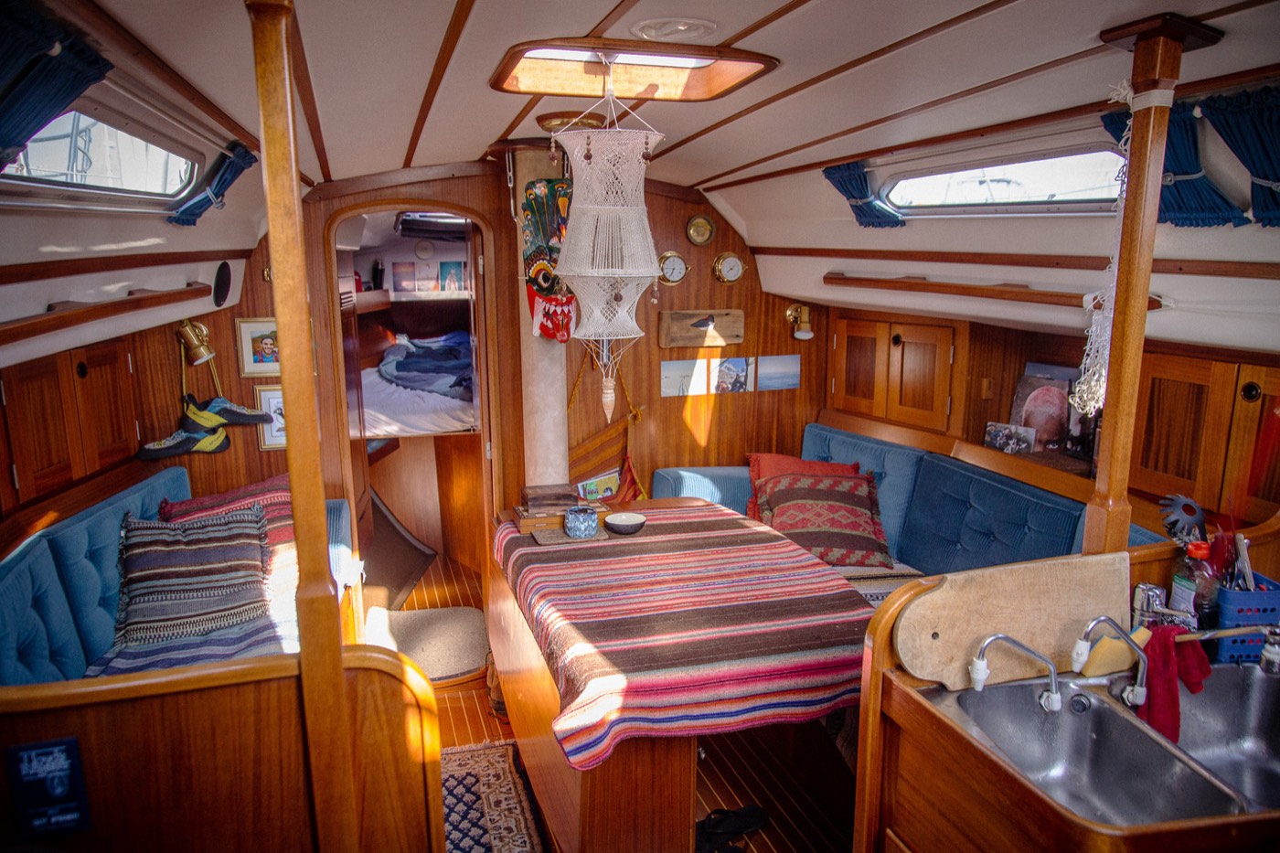 Falkor's wooden saloon with sofa berths and galley